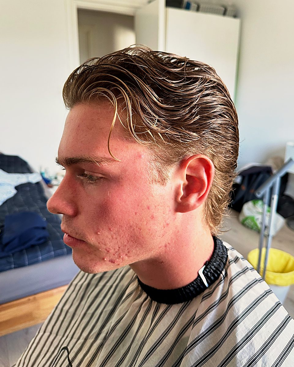 Long swept-back cut, in profile